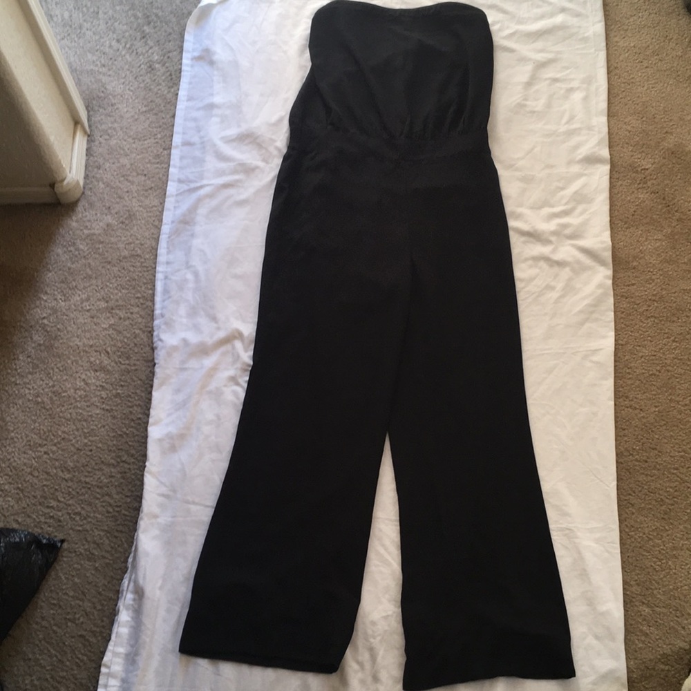 Black strapless jumpsuit with pockets